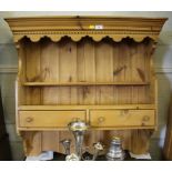 A pine hanging rack, with shaped dentil cornice and apron over two frieze drawers, 86cm wide and a