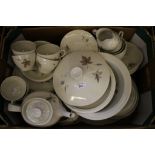 A Royal Doulton 'Tumbling Leaves' pattern part tea and dinner service, including two tureens and