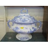 An Italian series blue and white tureen and cover of shaped form with pedestal foot and twin