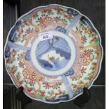 A Japanese Imari dish, the scalloped edge with floral panels, 25cm diameter