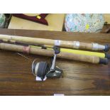 Three fishing rods and a reel