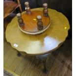 An oak tea trolley, with fold over baize top, a burr walnut coffee table, a yew-wood whatnot and a