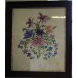 An embroidered floral panel within an oak frame, 57cm x 49cm