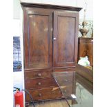 An early Victorian mahogany linen press, the cavetto cornice over a pair of flame mahogany