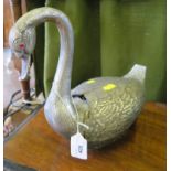 A silver plated flower holder in the form of a swan, with hinged wings and jewelled eyes (one