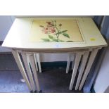 A nest of three painted bowfront tables, inset with floral panels, 55.5cm wide