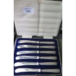 A cased set of six tea knives with silver handles