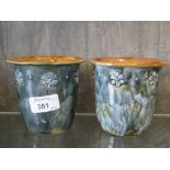 A Royal Doulton planter with blue green glaze and a band of flower heads, impressed mark numbered