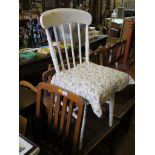 Three 1930's oak dining chairs, including a carver, with plain rail backs and square legs, and a