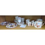 A Wedgwood part tea service with red and gilt floral decoration with shaped teapot, sugar bowl,