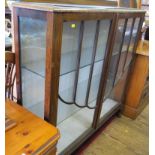 A 1920's walnut glazed display cabinet, with two doors on cabriole legs 119cm wide