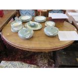 A Victorian walnut snaptop table, the oval top over a lobed stem on four cabriole legs, with