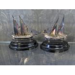 A pair of miniature sailing ships on stands marked 925 silver