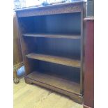 An oak open bookcase with lunette carved frieze, 83cm wide