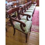 A set of eight early Victorian style mahogany dining chairs, the broad top rails over rosette carved