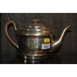 A George III silver teapot complete with silver teapot stand, London 1803 make J.E., 29cm long