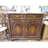 An inlaid French style side cabinet, with canted corners, the two frieze drawers over panelled doors