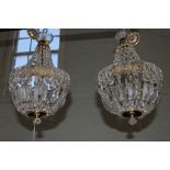 A pair of cut glass ceiling lanterns with square rosettes, 45cm high
