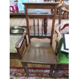 An Edwardian stained wood upright chair, with spindle back, sold seat and turned legs, and a piano