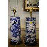 A matched pair of Chinese blue and white vases, cylindrical with pierced quatrefoil, each