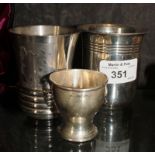 A silver mug stamped 925, together with a plated mug and silver egg cup