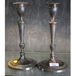 A pair of Adam style silver plated candlesticks