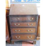 A 1930's mahogany bureau, the sloping fall over four long graduated drawers on bracket feet, 61cm