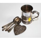 A silver mug, eight teaspoons with mixed dates and a pen wipe