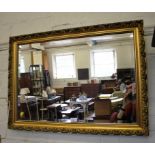 A giltwood circular convex mirror, with foliate pierced frame, 50cm diameter and a rectangular