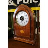 An Edwardian inlaid mahogany cased 'Bulle' battery powered clock, the pointed arch case with