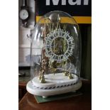 A Victorian brass skeleton clock, the triple lancet arch shaped frame with white painted dial, the