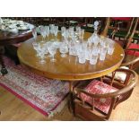 A pine breakfast table, the circular top on a tripod base of baluster stem and cabriole legs,