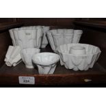 Three large Shelley jelly moulds and five other jelly moulds, all marked Shelley