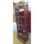 A 19th century style mahogany whatnot with four shelves, two drawers to the base and fret carved