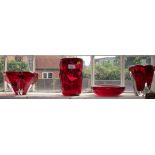 Three 1970's Whitefriars cranberry red glass vases and a bowl with air bubble decoration (4)