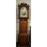 A mid 19th century oak and mahogany inlaid longcase clock, the swan-neck pediment with turned