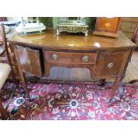 A late George III style crossbanded mahogany bowfront sideboard with ebony stringing, the central