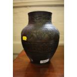 A Chinese bronze vase, of tapering form with bands of decoration, as found, 22cm high