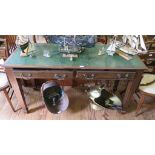 A 1920's mahogany side table, the linoleum inset top over two frieze drawers on square section