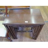 A mahogany nest of three tables, with rectangular tops and moulded legs, 61cm wide