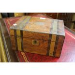 A Victorian brass bound writing box, with inlaid bands, the interior with leather lined slope and