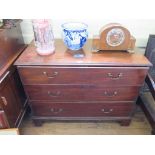 A George III mahogany bachelors dressing chest, the top with moulded edge over three long drawers