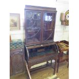 An Edwardian beaded mahogany roll top bureau bookcase, with moulded cornice over beaded glazed