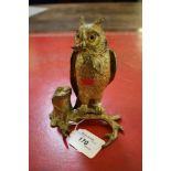 A gilt bronze inkwell in the form of an owl holding a bat on a branch, with two lidded compartments,