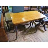 A mahogany side table, the later rectangular top on Victorian ring turned legs with brass caps and