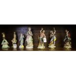 Three Italian figures of pirates, 22cm high, four other figures and posy (8)