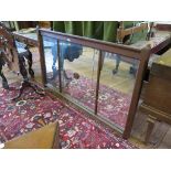 An oak framed overmantel mirror, the panelled glass within a chamfered frame, 164cm x 99cm