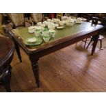 An Edwardian mahogany library table, the leather inset top with moulded edge over turned tapering