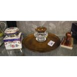 Cut glass inkwell mounted on a circular mahogany tray with a decorative brass stud lid, together