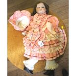 A C.M. Bergmann bisque doll no. 7a 1916, brown closing eyes, teeth and brown hair, in pink Victorian